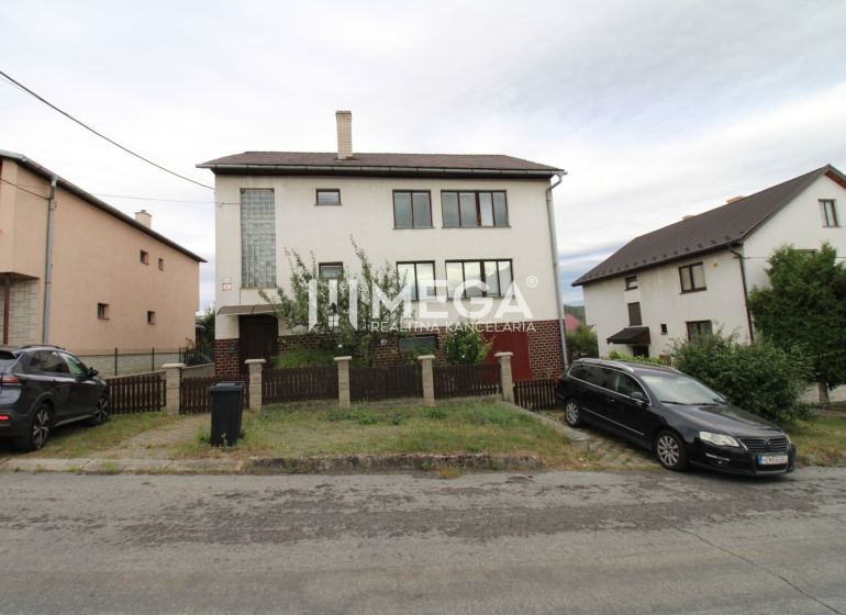 A family house in Snina on Snina Street with a garden and parking in front of the house.