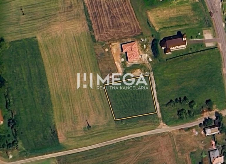 A satellite view of residential plots in the village of Víťazovce, surrounded by greenery and buildings.