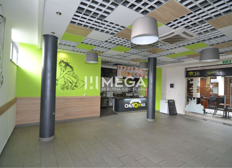 Interior of commercial spaces with decoration and a fast food counter.