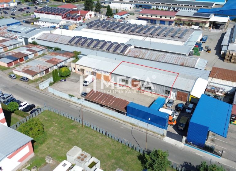 The industrial zone on Fidlikova Street in Humenné includes warehouses and halls with solar panels.