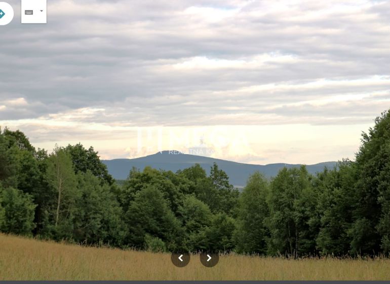 Forests and fields in Maškovce with a view of the hills and the sky.