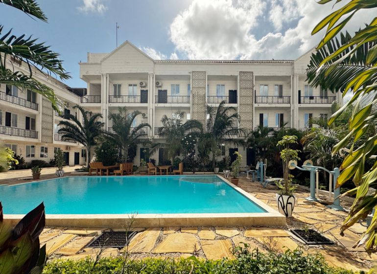 Residence in Mbweni, Zanzibar with a pool and tropical garden.