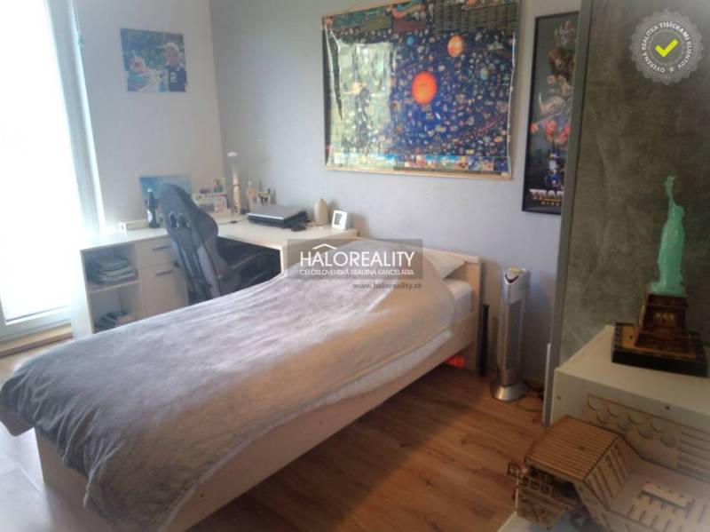 Children's room with a desk, bed, and decorations in a 3-room apartment.