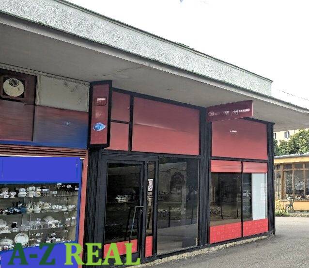 Commercial premises on Herlianska Street in Bratislava - Ružinov with display windows and an entrance.