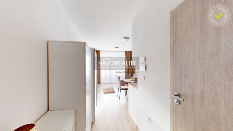 Entrance hallway with a view of the dining area in a 2-room apartment.