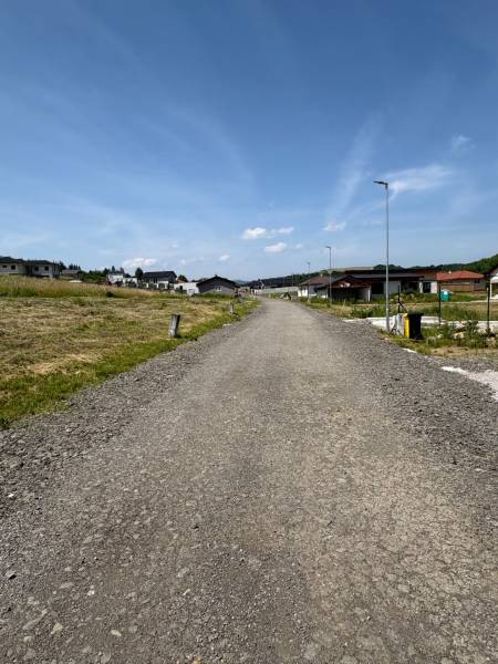 Land - residential area, Gregorovce, with new houses and lamps in the background.