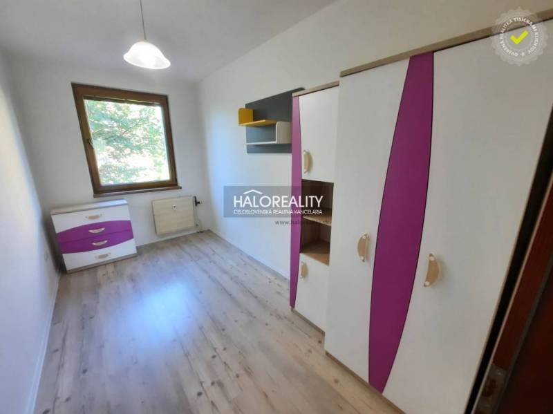 Children's room in a 4-room apartment with colorful furniture and wooden flooring.