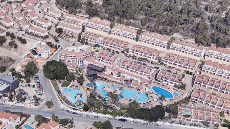 A holiday apartment in Calpe surrounded by villas and swimming pools with panoramic views.