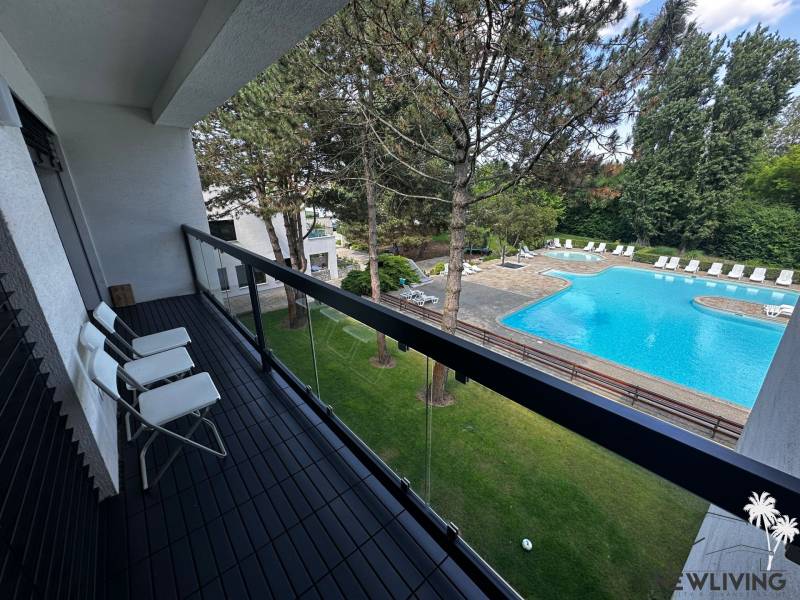 Balcony of a 2-room apartment with a view of the pool on Rekreačná Street in Piešťany.
