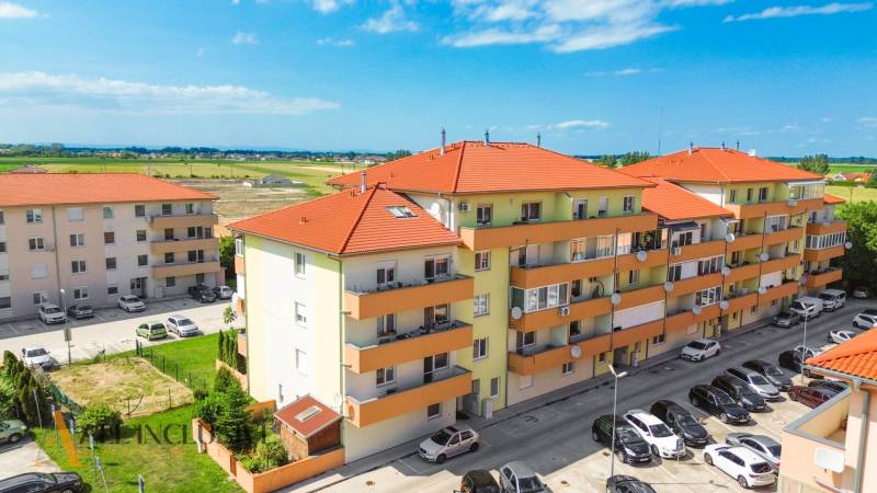 Apartment buildings on Záhradnícka Street in Dunajská Streda with a parking lot and surroundings.