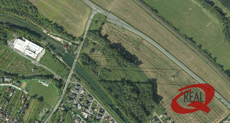 Aerial view of properties - housing in the village of Podtureň near the road and river.