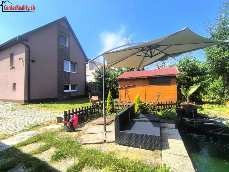 A family house in Nitrica with a garden seating area and a gazebo.