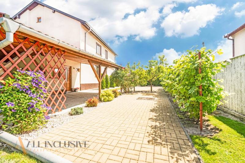 A family house in Sapa with a landscaped garden, terrace, and paved walkway.