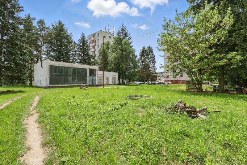 Plots - housing on Slnečná Street in Kováčová surrounded by greenery and buildings.
