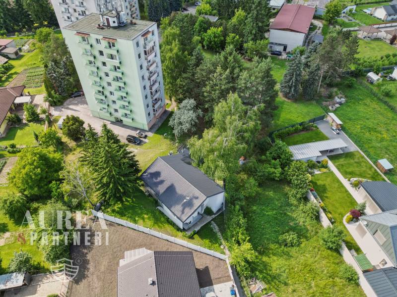 View of the apartment building and greenery on Slnečná Street in Kováčová, Residential plots.