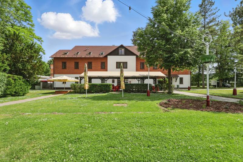 Building with a terrace and green lawn on Slnečná Street in Kováčová, Land - residential.