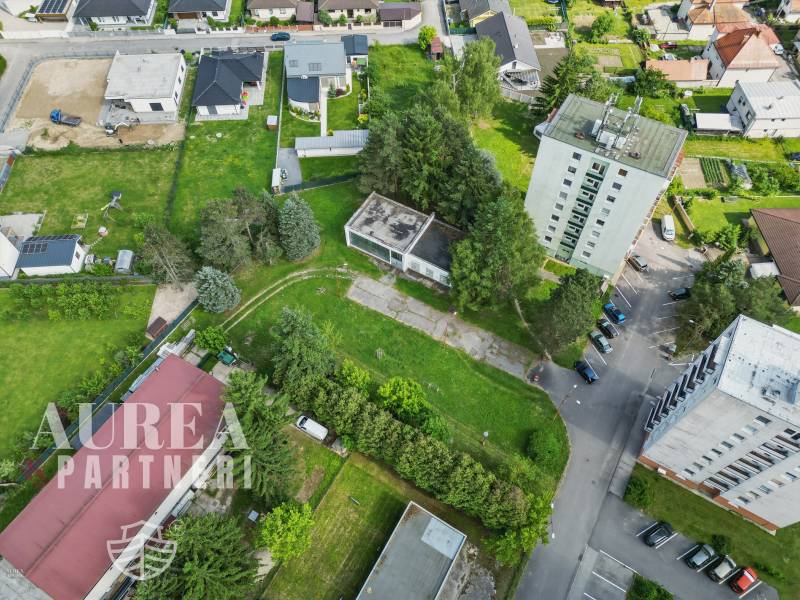 Aerial view of Slnečná Street, Kováčová, type: Residential land with apartment building and houses.