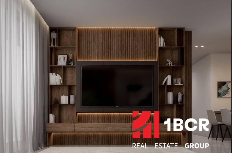 Elegantly lit living room with a wooden wall, television, and shelves in a 3-room apartment.