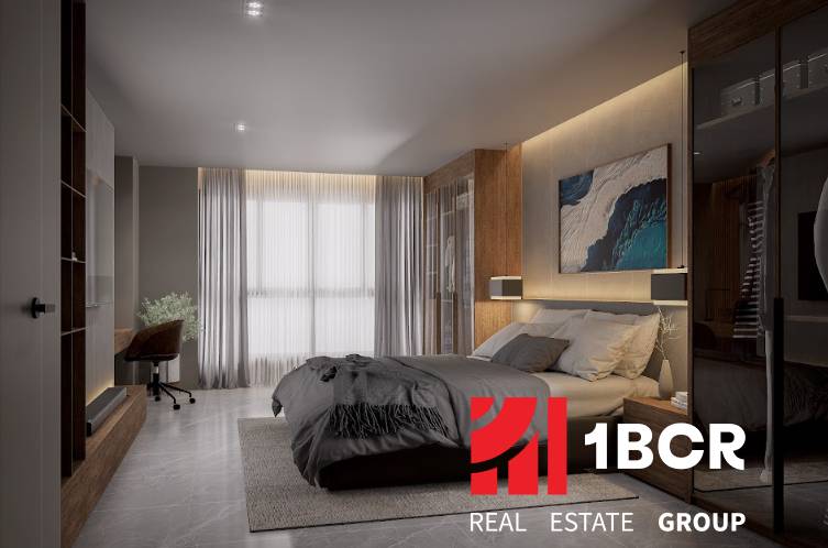 A bright bedroom with a bed and a desk in a 3-room apartment.