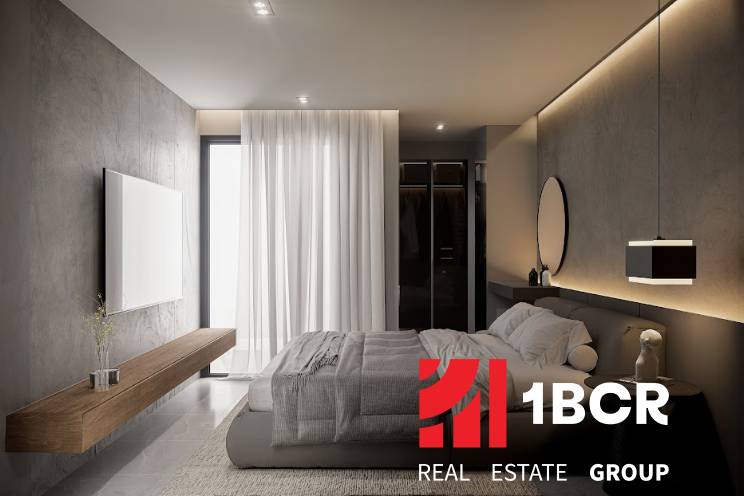 A stylish bedroom with a large bed, television, and minimalist design in a 3-room apartment.