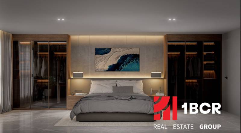 Stylish bedroom in a 3-room apartment with a double bed and built-in wardrobes.
