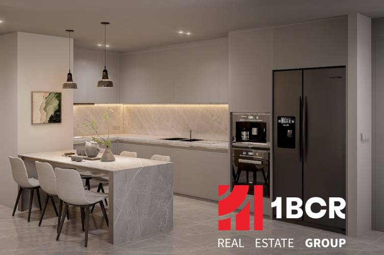Modern kitchen in a 3-room apartment with an island, dining table, and appliances.