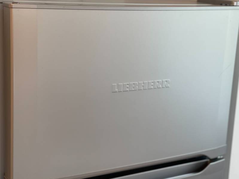 Liebherr refrigerator with a silver finish in a 2-room apartment.