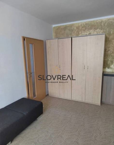 Wardrobe and benches in the room of a 3-room apartment.