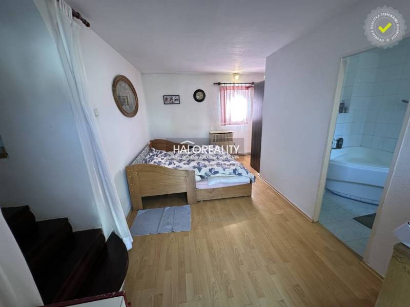 Bedroom with a stylish bed and decoration in a family house.
