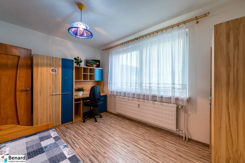A room in a 3-room apartment with a desk, a wardrobe, and a chair.