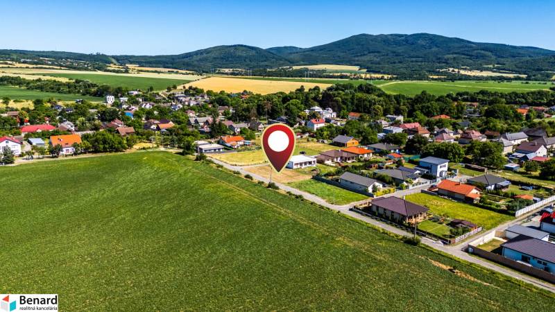 Residential plots in Nižná Kamenica, surrounded by picturesque landscape and hills.