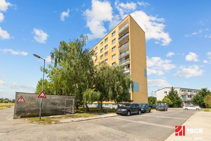 Apartment building on Na pasekách Street, Bratislava - Rača, surrounded by greenery.