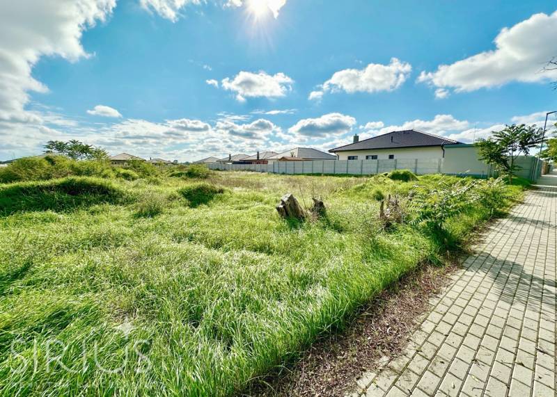 Plots - housing at Južná Brána in Senec with a grassy area and a walkway.