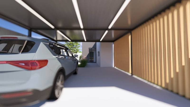A car parked in a shelter next to a family house in Gaboltov.