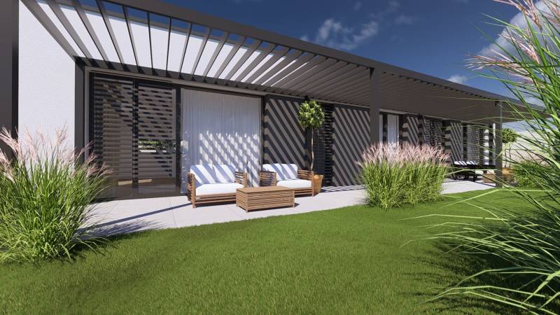 Family house in Gaboltov with a terrace, garden furniture, and ornamental grasses in the garden.
