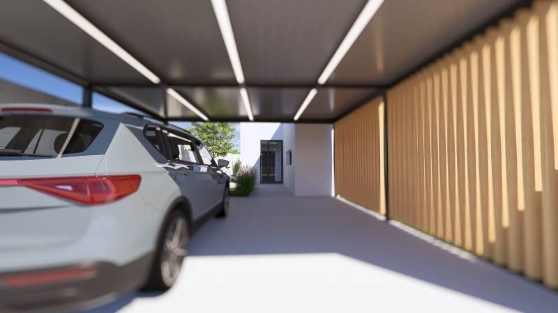 A car parked under the shelter of a family house in Gaboltov, next to wooden cladding.