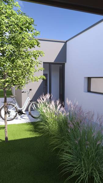 A family house in Gaboltov with a bicycle, a tree, and ornamental grass.