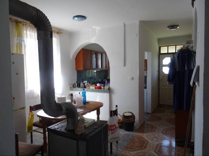 Kitchen with a dining table and stove in a family house.