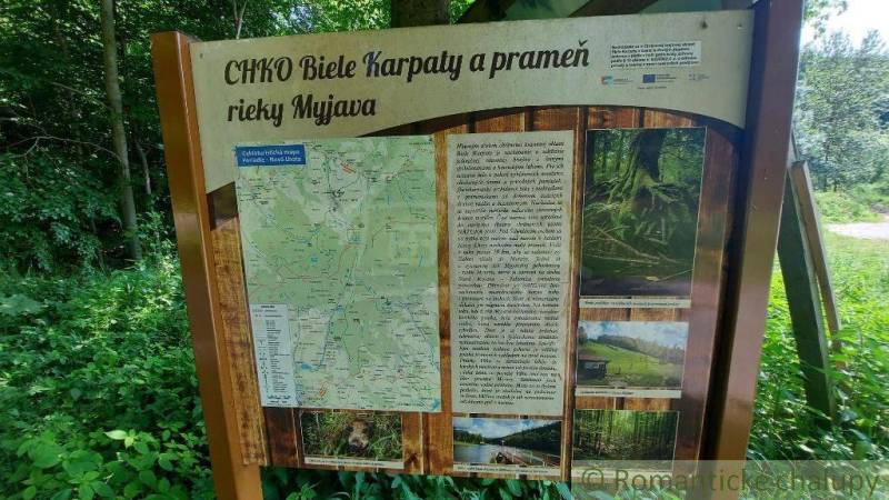 Information board of the White Carpathians Protected Landscape Area and the source of the Myjava River in nature.