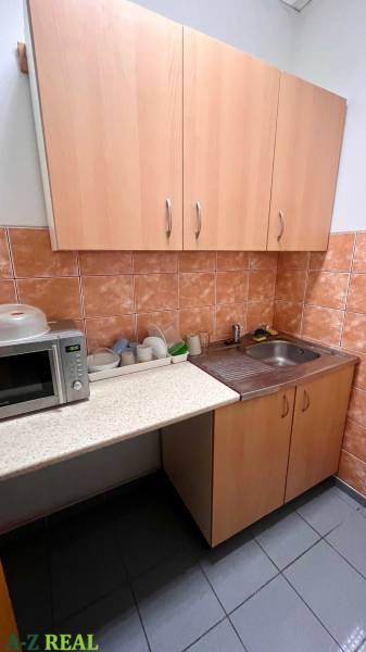 Offices with a kitchenette, microwave, and sink.