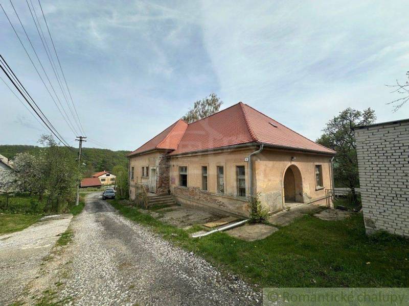 A family house in Rimavská Sobota with a red roof and a large yard.