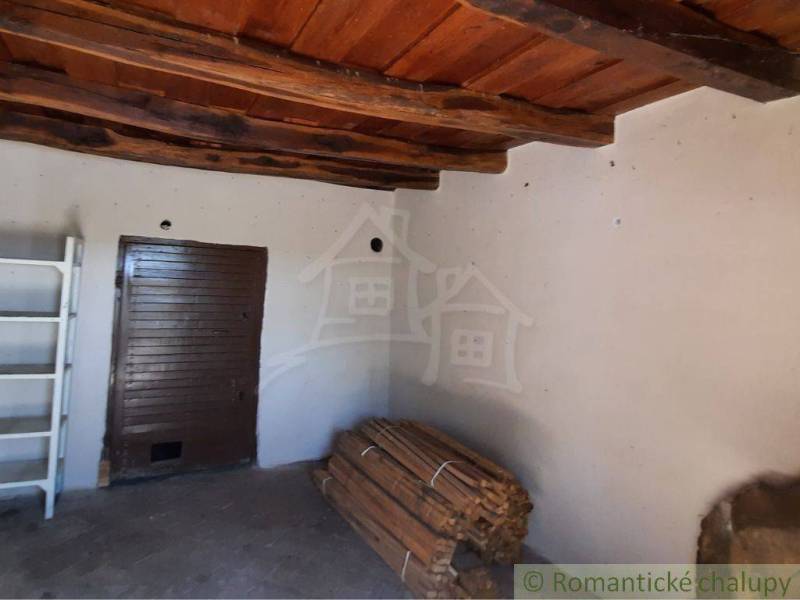 Wooden ceiling, brown doors, and a wood storage in the cabin.