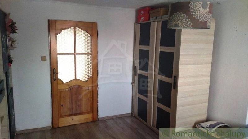 Interior of a family house with a wardrobe and wooden doors.