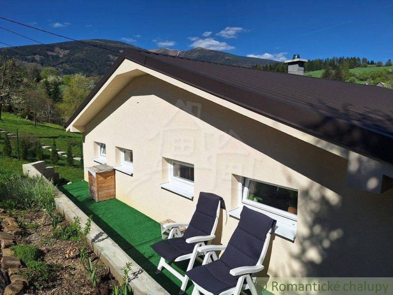 A family house in Liptovský Mikuláš with a terrace and garden, surrounded by nature.