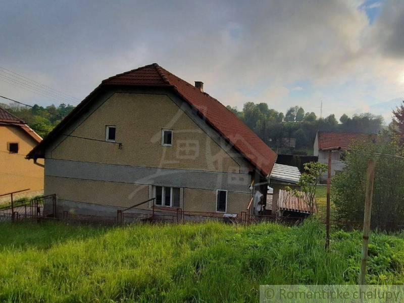 A family house in Žiar nad Hronom with a sloped roof and green surroundings.