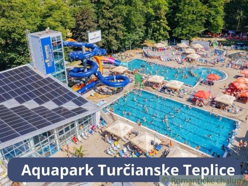 Aquapark Turčianske Teplice with pools, water slides, and relaxation facilities amidst nature.