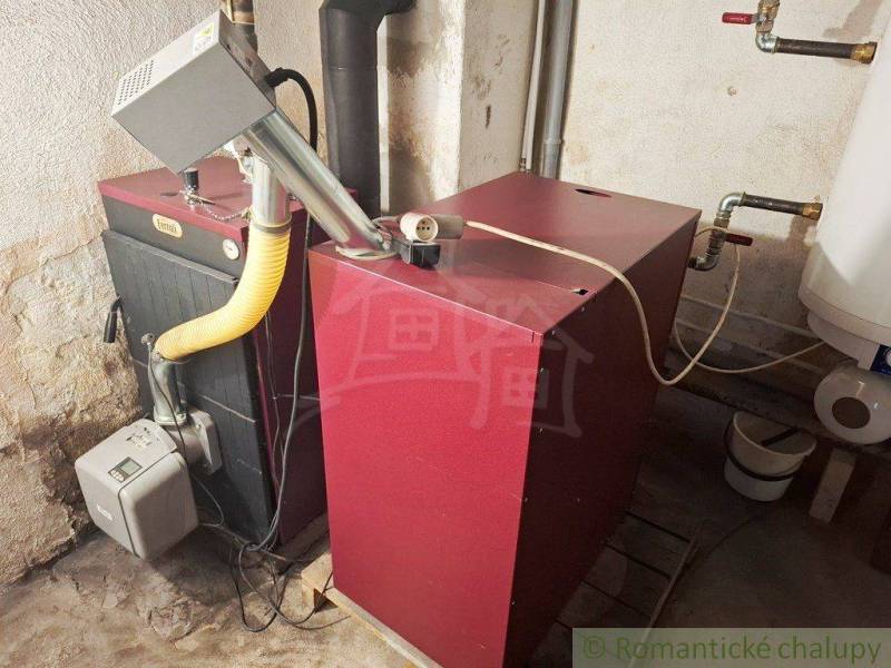 Boilers and pipes in the boiler room of a family house, connection to the heating system.