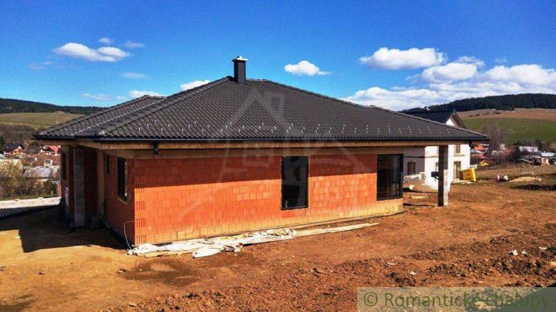 A family house under construction in the countryside surrounded by nature, peaceful environment, spacious plot.