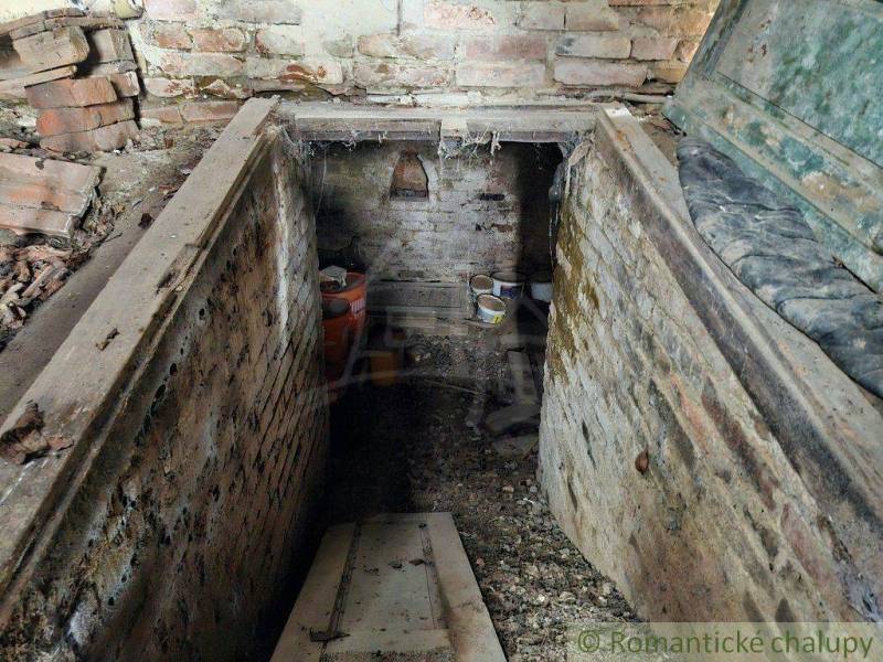 An old cellar with brick walls and objects, clutter in a family house.