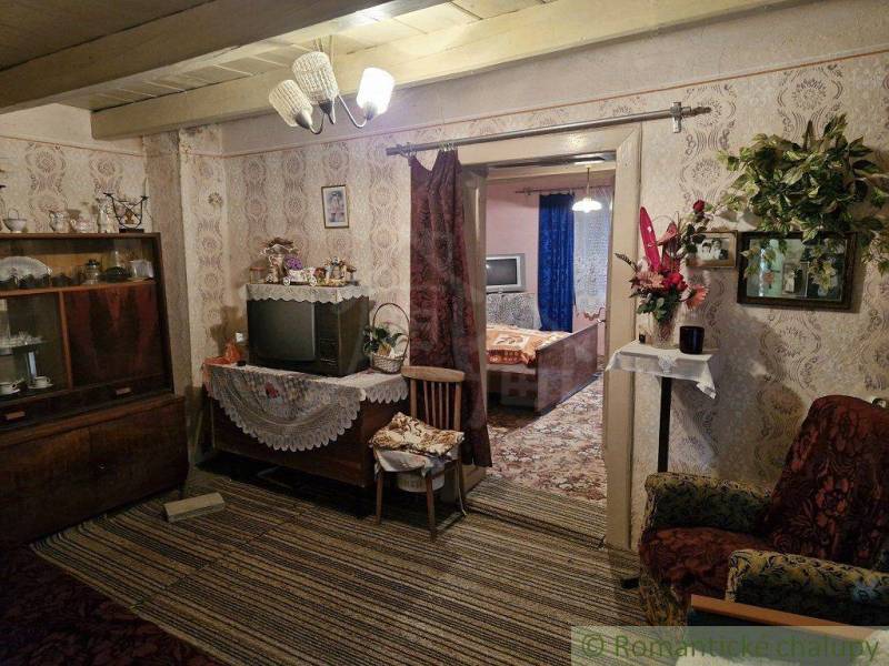 Retro living room in a family house, antique furniture and a television with decorations.